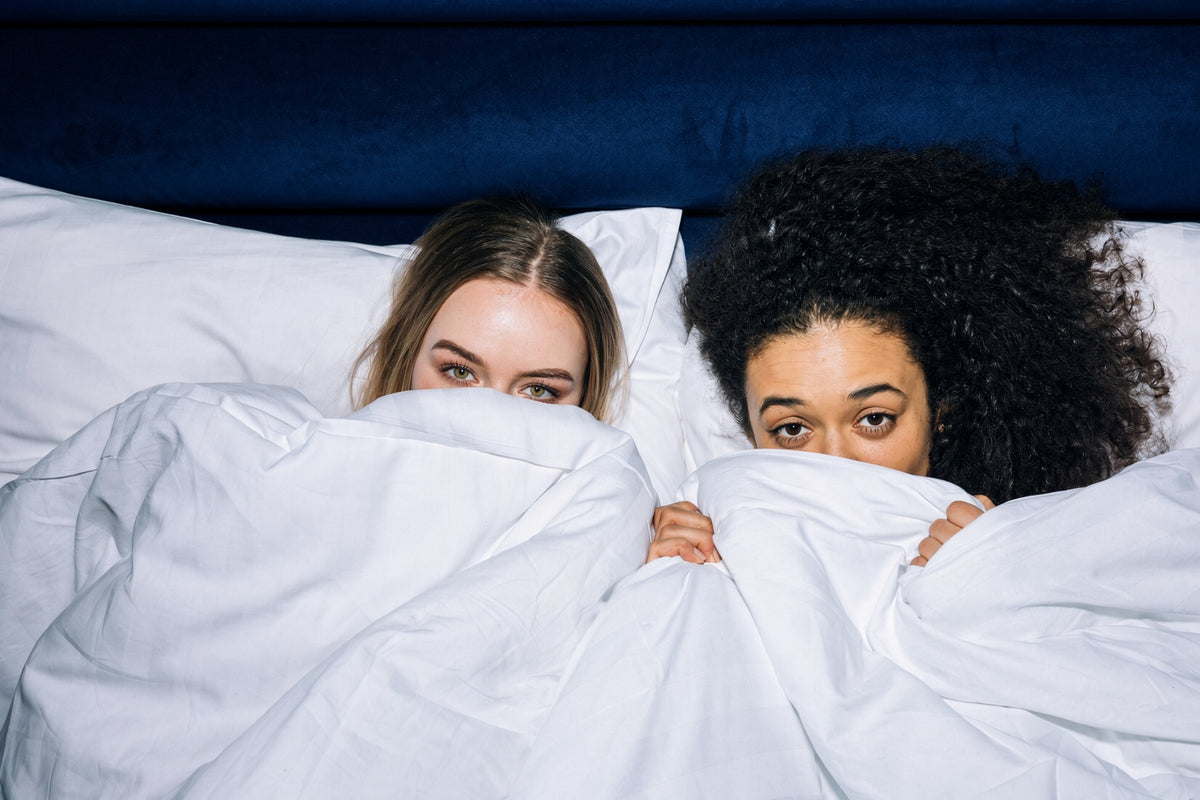 Side sleeper in a guest bed, shoulder in the pillow opening